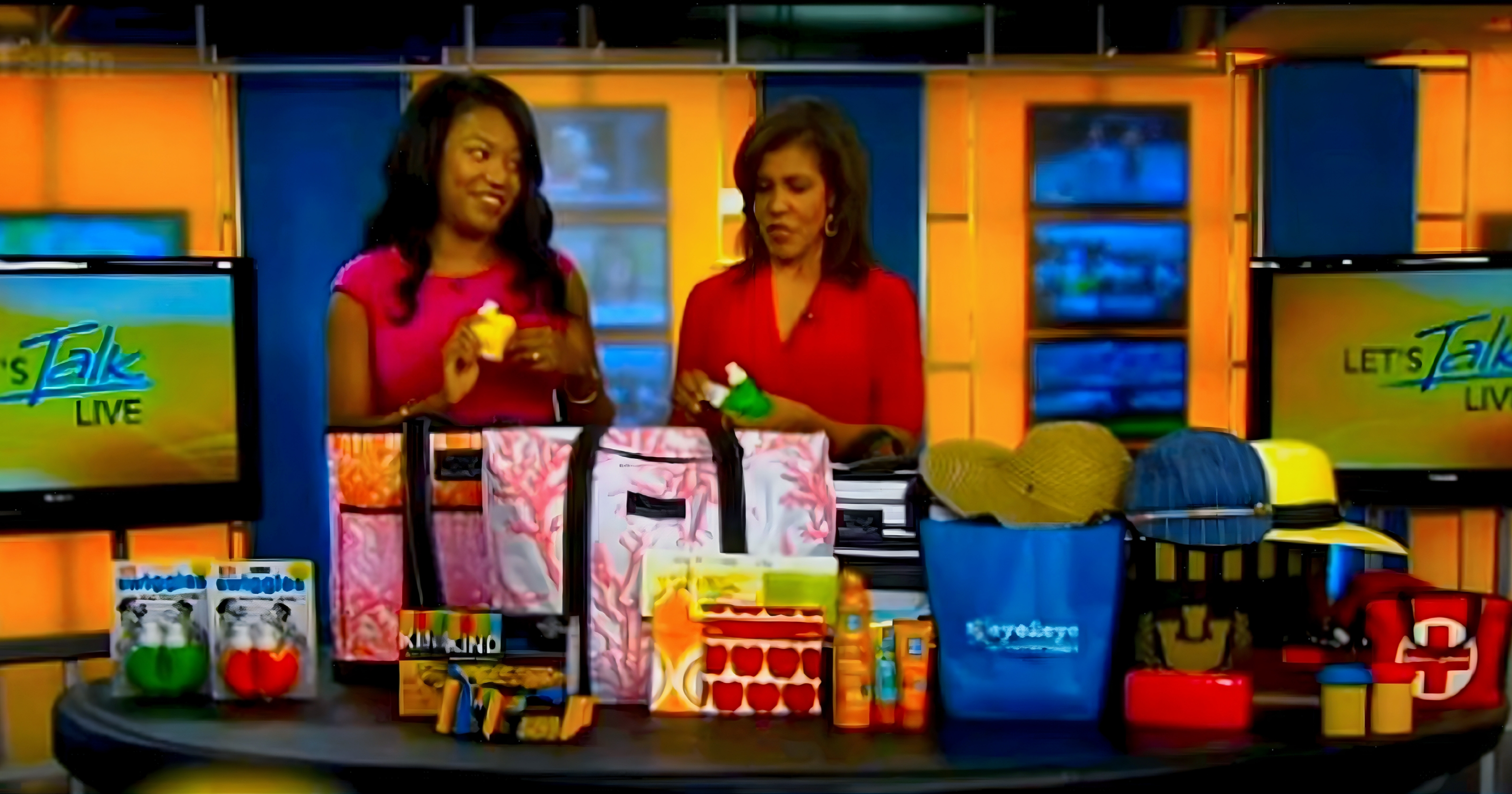 A Swiggies wrist water bottle being demonstrated on the Let's Talk Live TV set.